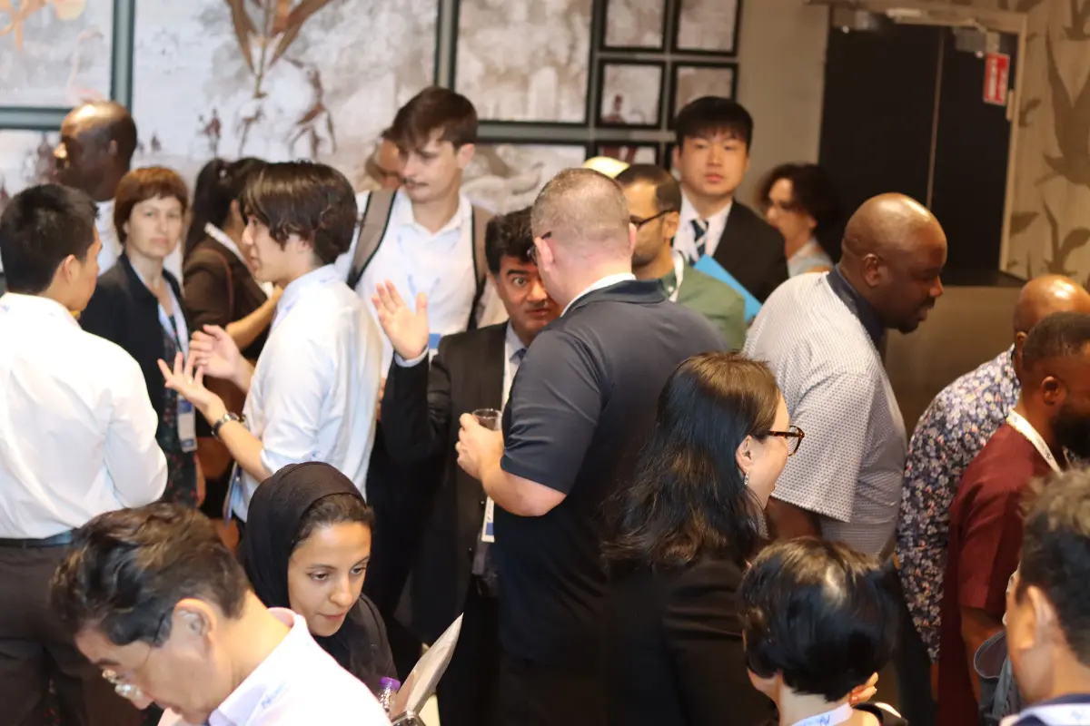 Diverse delegates networking at an Acavent academic conference